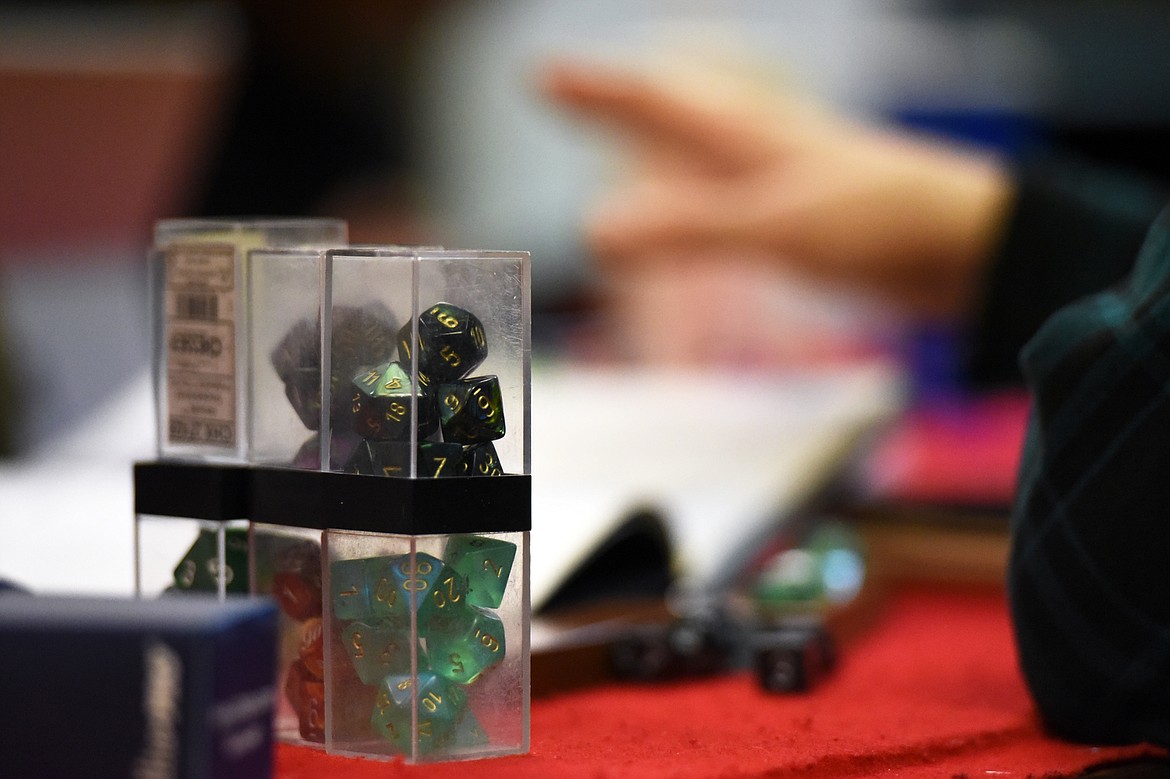 Sets of polyhedral dice sit before a participant during a game of Dungeons &amp; Dragons at Heroic Realms Hobbies &amp; Games in Evergreen on Thursday, Nov. 14. (Casey Kreider/Daily Inter Lake)