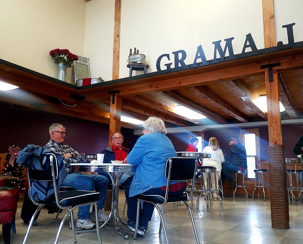 Patrons sample Judy Sowards&#146; beignets during her open house sampling, which continues for the first two weeks of December.