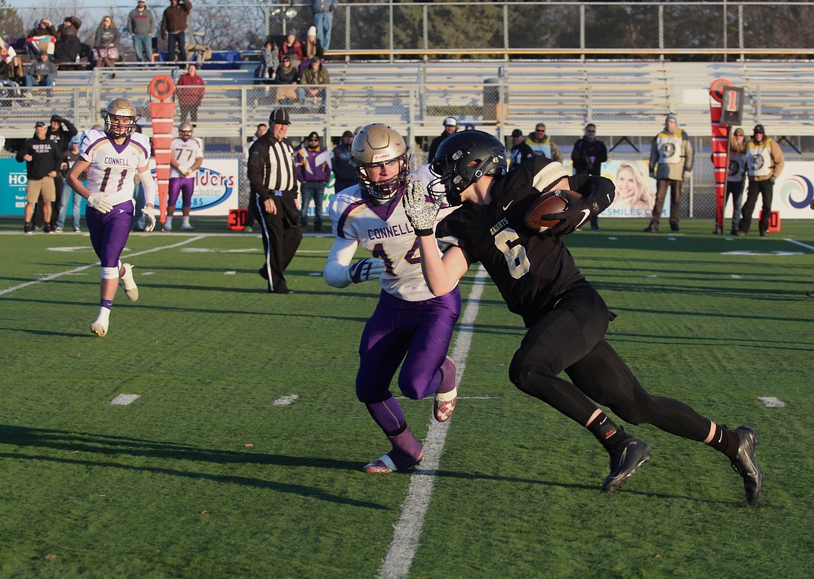 Casey McCarthy/Sun Tribune 
Royal&#146;s Derek Bergeson looks to make the cut upfield as the Connell defender closes in on Saturday in the 1A State semifinal.