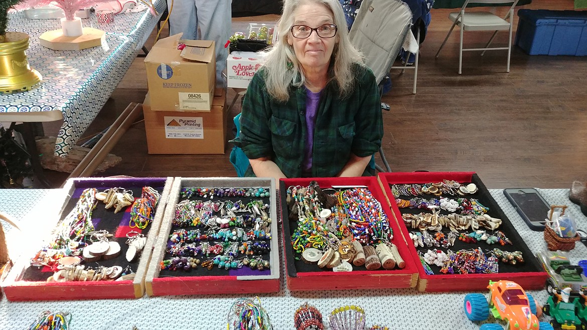 Jill Fry, with samples of the hand made, beaded jewelry she and her husband Elmer produce, at the St. Regis Christmas Bazaar. (Chuck Bandel/Mineral Independent)