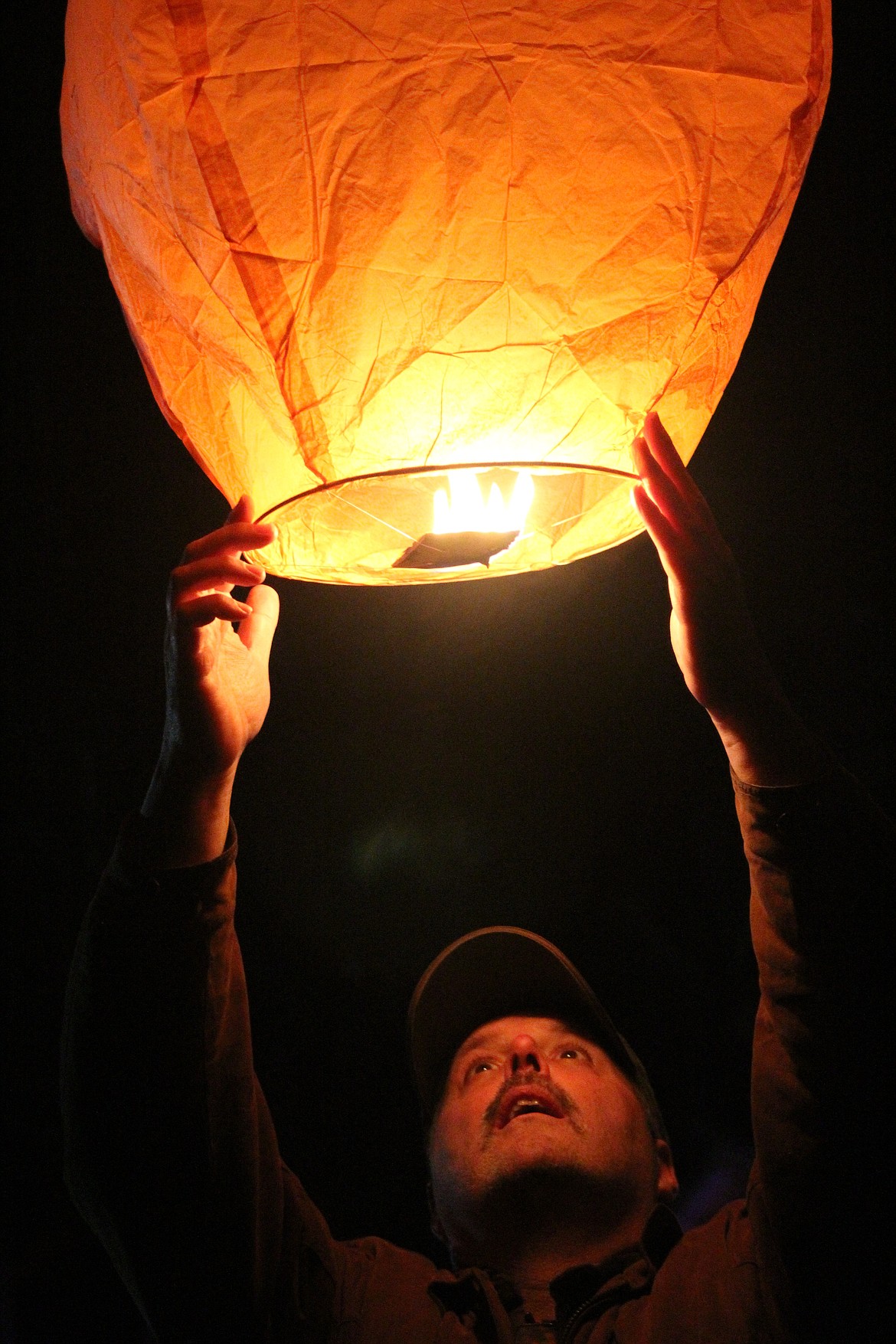 STEVE SEILHYMER released a lantern Saturday night. (John Dowd/Clark Fork Valley Press)