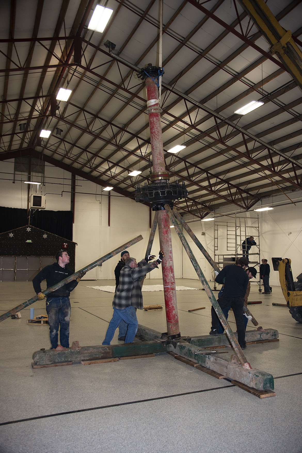 (Photo courtesy CLAY HUTCHISON)
The half-ton center pole for the Carousel of Smiles, pictured here before its recent refurbishment, bears the weight of 36 ponies, two chariots and riders. The pole now has a smooth surface and a fresh coat of paint after a trio of Triangle Drive businesses took it in for various stages of refurbishment.