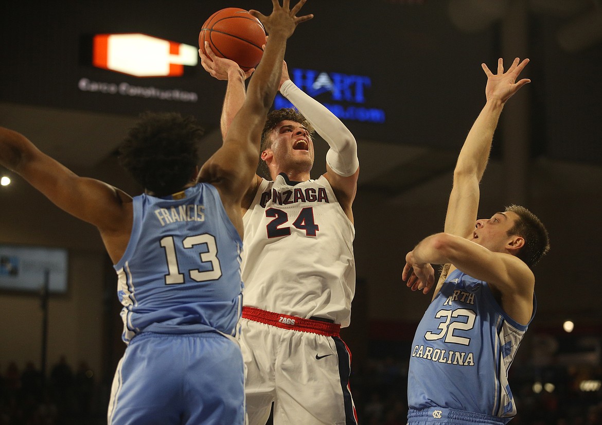 Gonzaga's Corey Kispert goes up for a shot between University of North Carolina defenders Jeremiah Francis, left, and Justin Piere during Wednesday's game at the McCarthey Athletic Center. (LOREN BENOIT/Press)