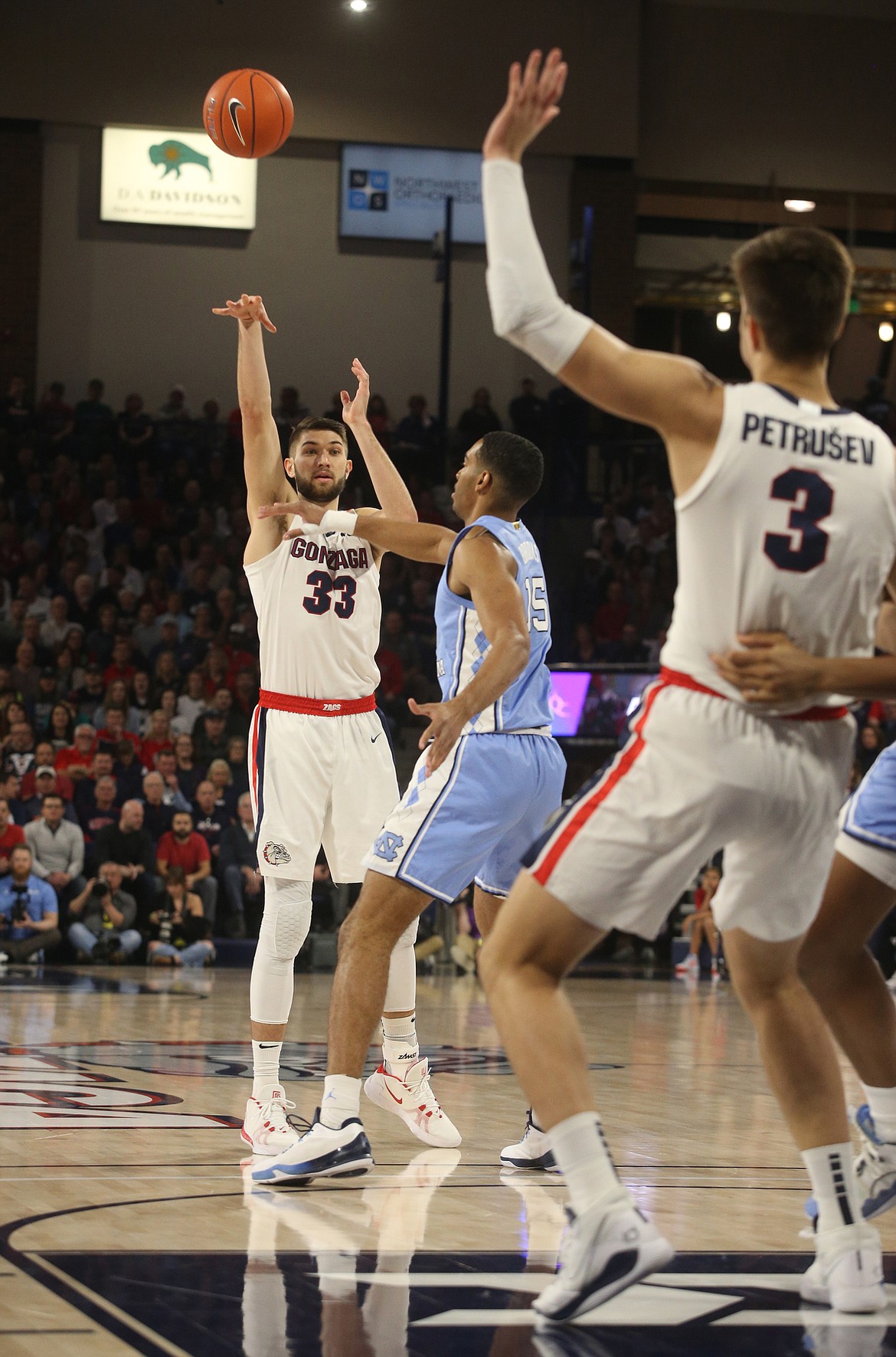 Gonzaga's Killian Tillie passes the ball to Filip Petrusev against University of North Carolina Wednesday night at McCarthey Athletic Center. (LOREN BENOIT/Press)