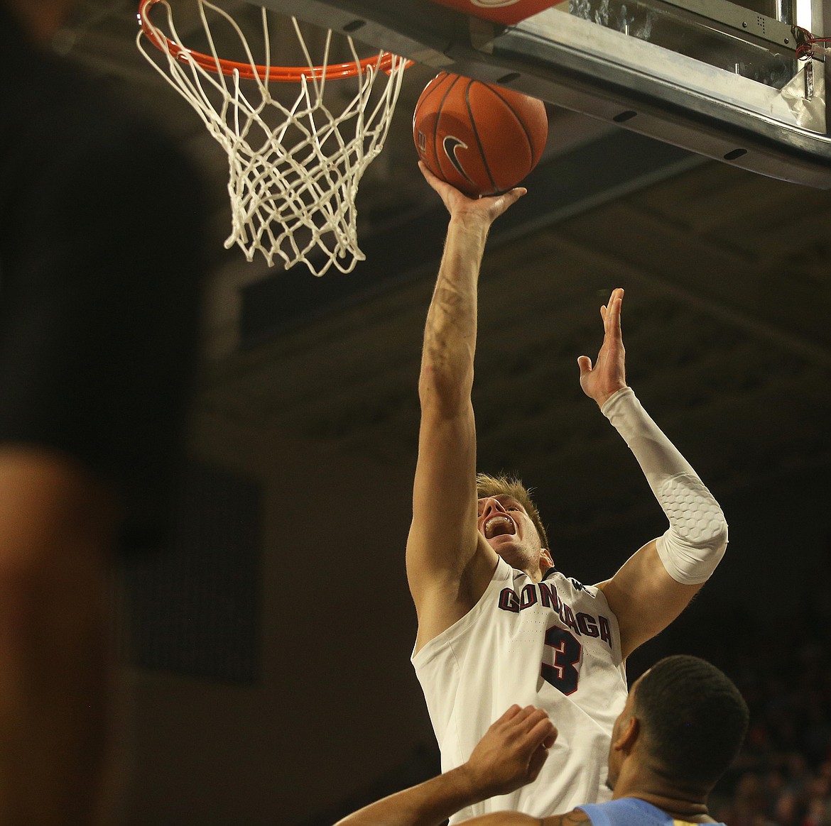 Gonzaga's Filip Petrusev drives to the basket while defended by University of North Carolina's Garrison Brooks Wednesday at the McCarthey Athletic Center. (LOREN BENOIT/Press)