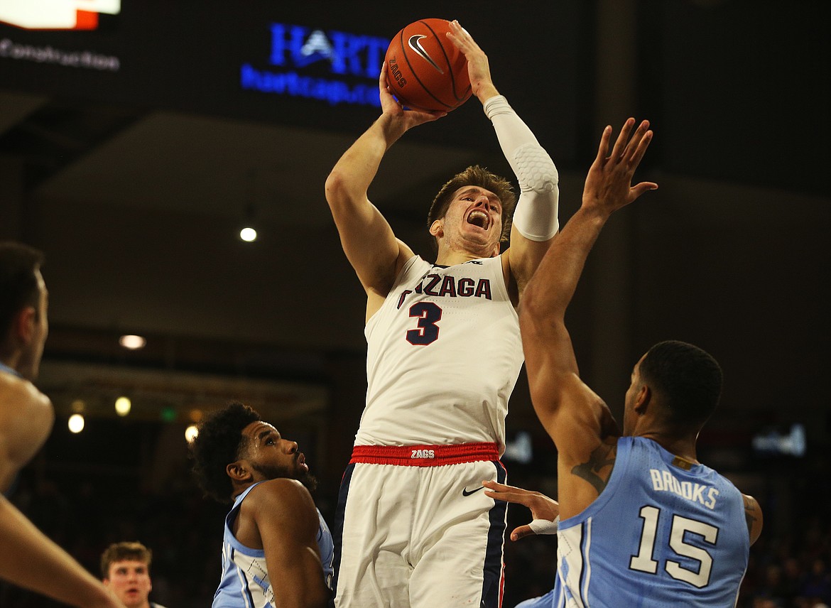 LOREN BENOIT/Press
Gonzaga&#146;s Filip Petrusev drives to the basket while defended by North Carolina&#146;s Garrison Brooks Wednesday at the McCarthey Athletic Center.