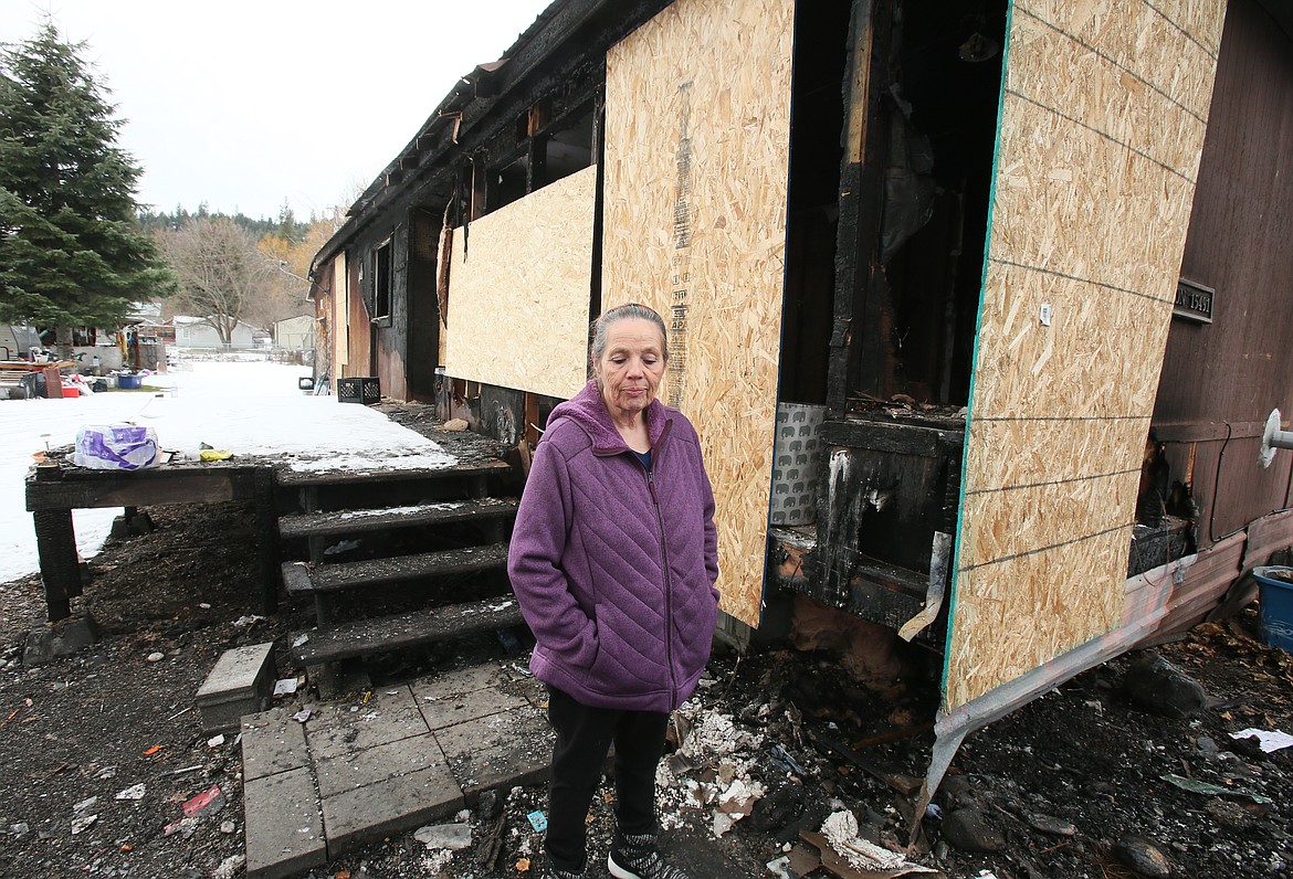 DEVIN WEEKS/Press
Wanda Lyon stands near what remains of her Rathdrum home as she recalls how she and her family narrowly escaped the fire that left them homeless Thanksgiving morning.