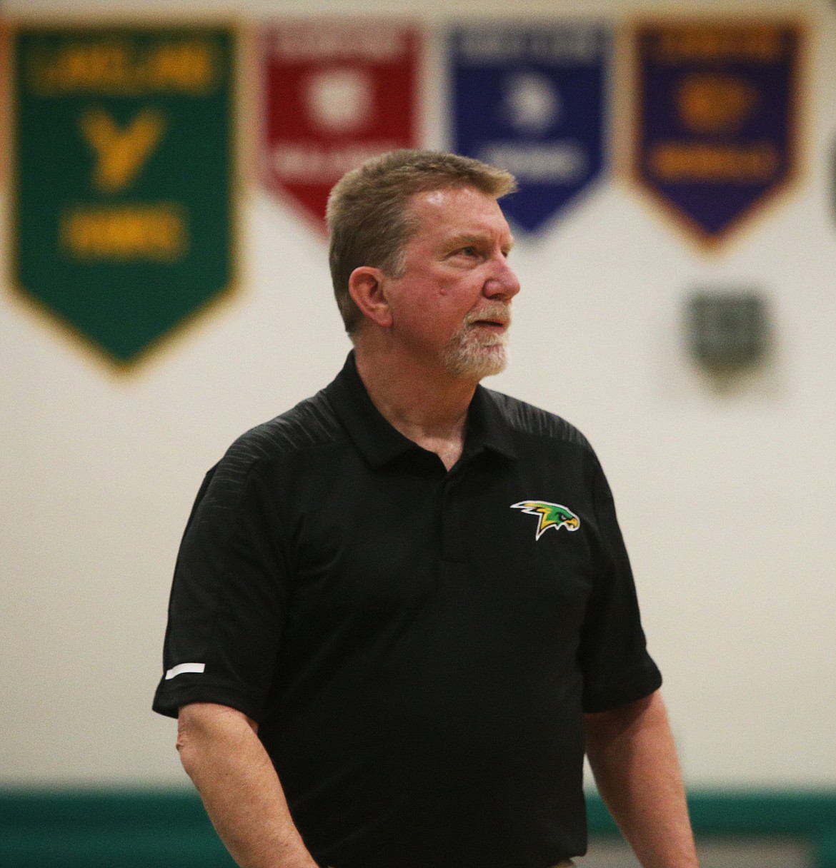 Lakeland basketball head coach watches his players during a game against St. Maries Tuesday night at Hawk Court. (LOREN BENOIT/Press)
