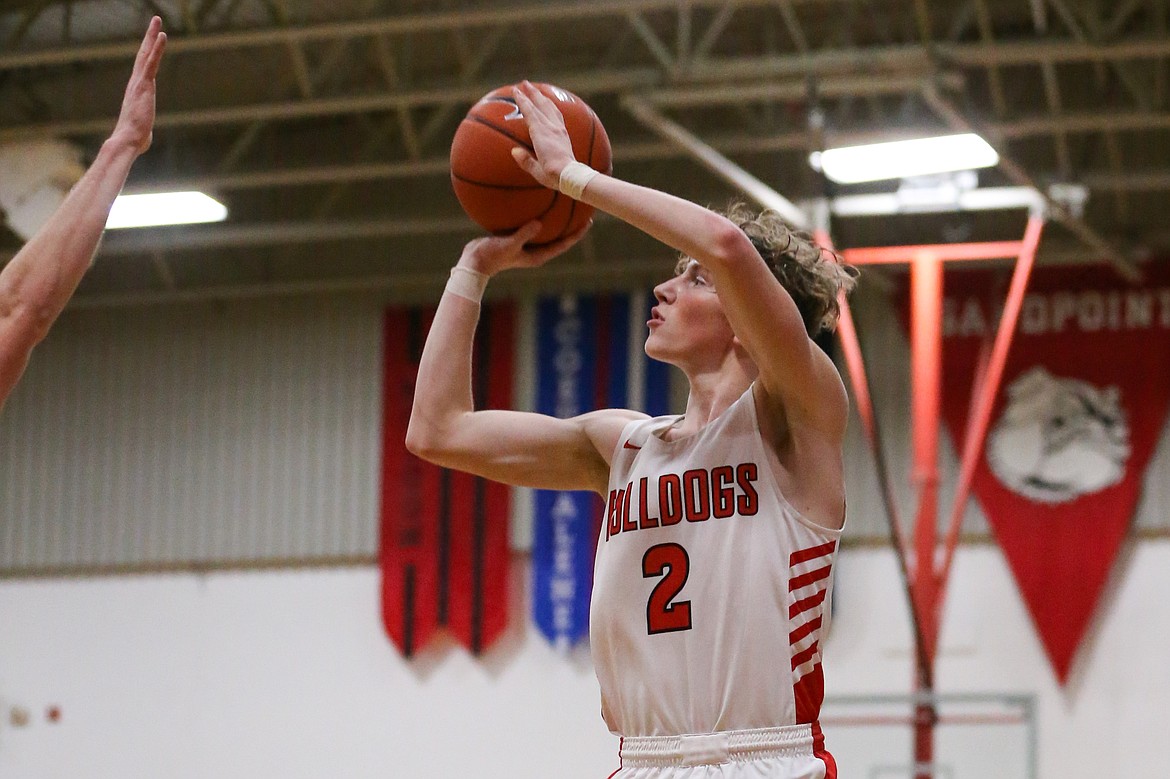 (Photo courtesy of JASON DUCHOW PHOTOGRAPHY)
Senior Kobe Banks pulls up and hits three-pointer during Thursday's game.