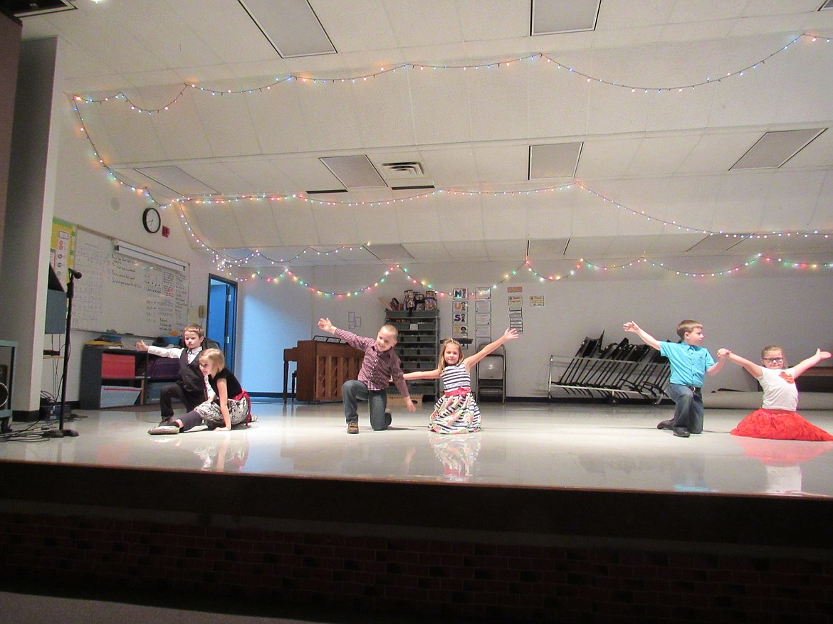 (Photo courtesy IDAHO HILL ELEMENTARY)Idaho Hill Elementary students perform at the school's winter program on Dec. 11. The performance drew a packed house and helped the students and their families usher in the holiday season.