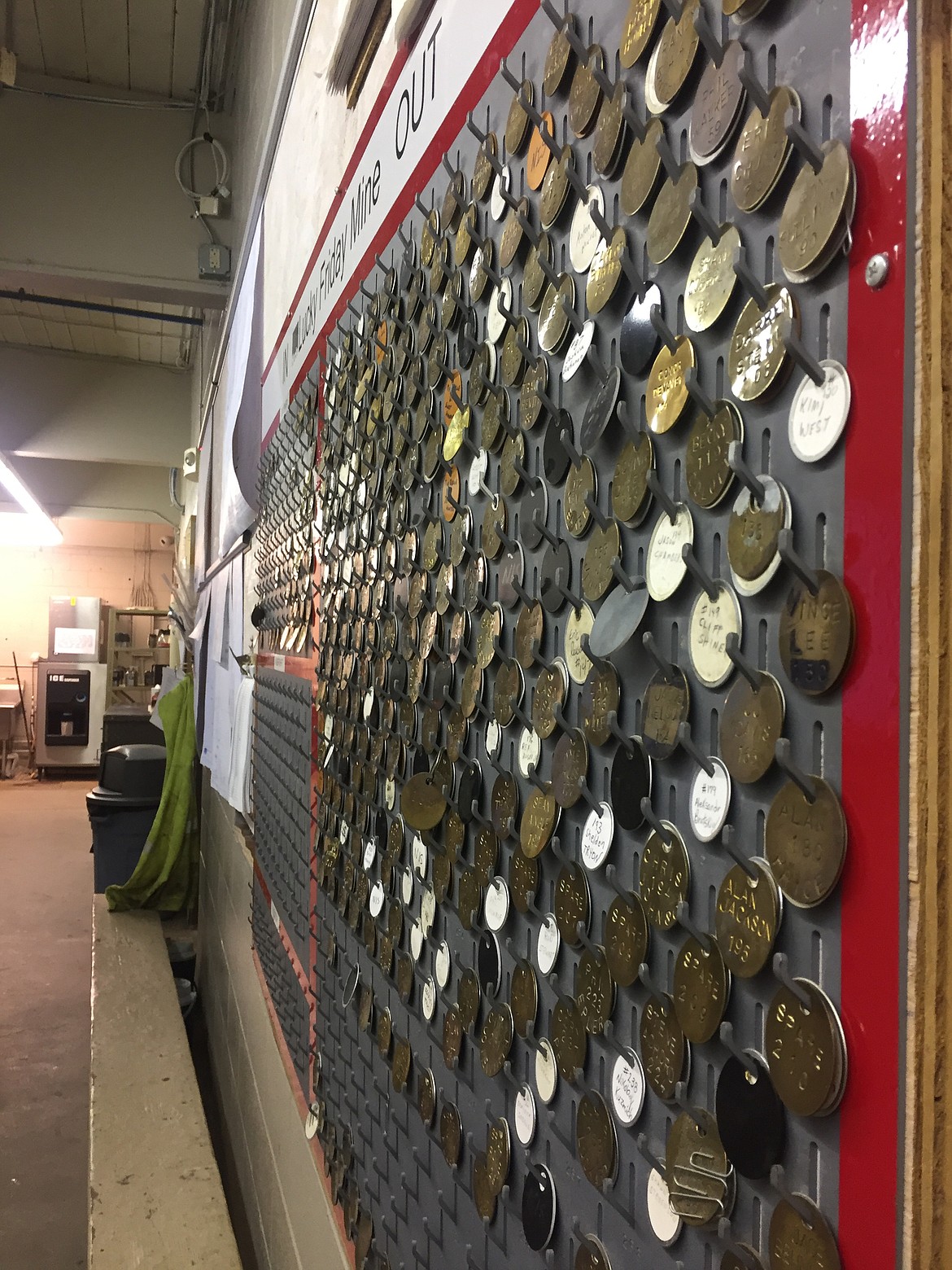 The in/out board outside the dry (the locker room) at Lucky Friday Mine tracks how many miners are below ground. The &quot;Out&quot; board has been heavy with union tags for almost 3 years. (JENNIFER PASSARO/Press)