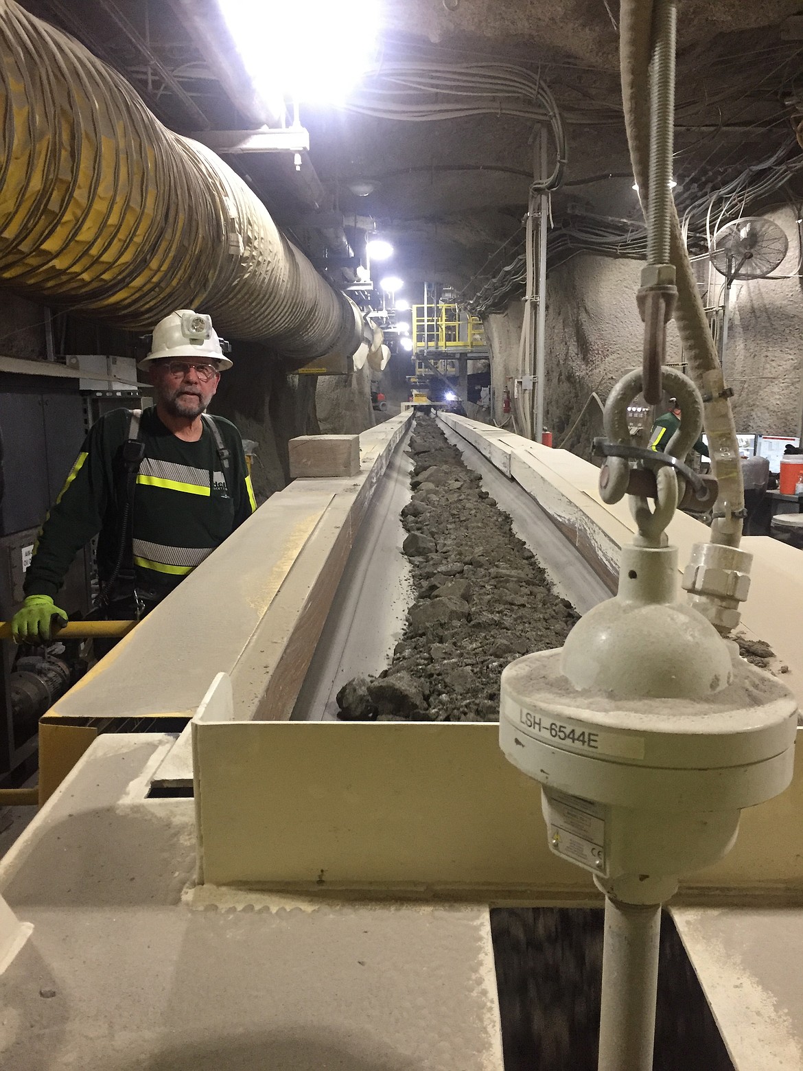 Clayr Alexander watches ore travel the belt to the #4 shaft, where it will be transfered to the surface and processed. 

JENNIFER PASSARO/Press