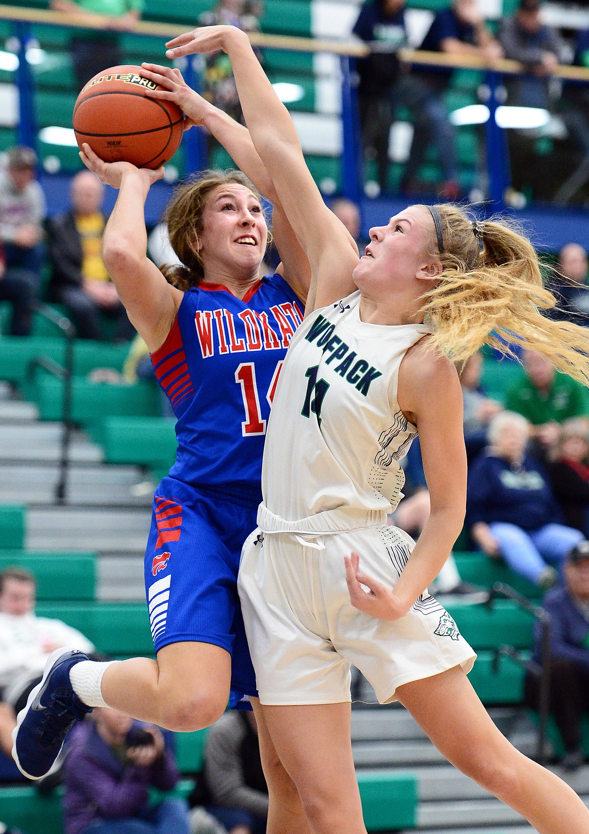 Columbia Falls' Josie Windauer goes to the hoop against Glacier's Aubrie Rademacher in the third quarter against Glacier at Glacier High School on Thursday. (Casey Kreider/Daily Inter Lake)