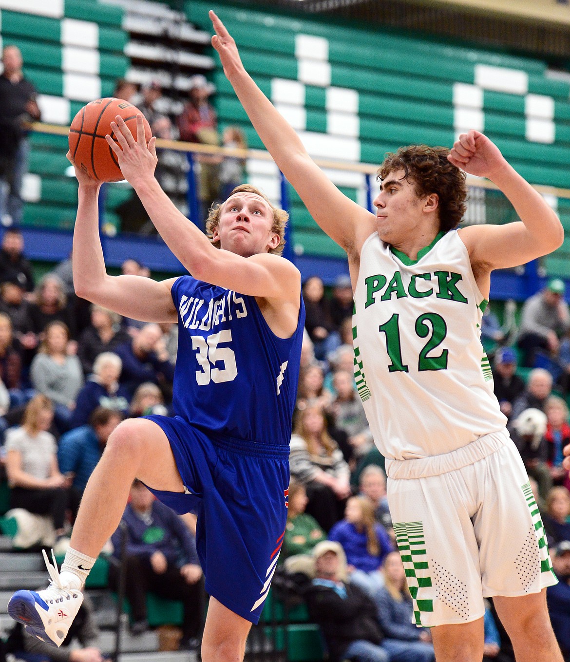 Columbia Falls' Allec Knapton drives to the basket against Glacier's Weston Price in the second half at Glacier High School on Thursday. (Casey Kreider/Daily Inter Lake)