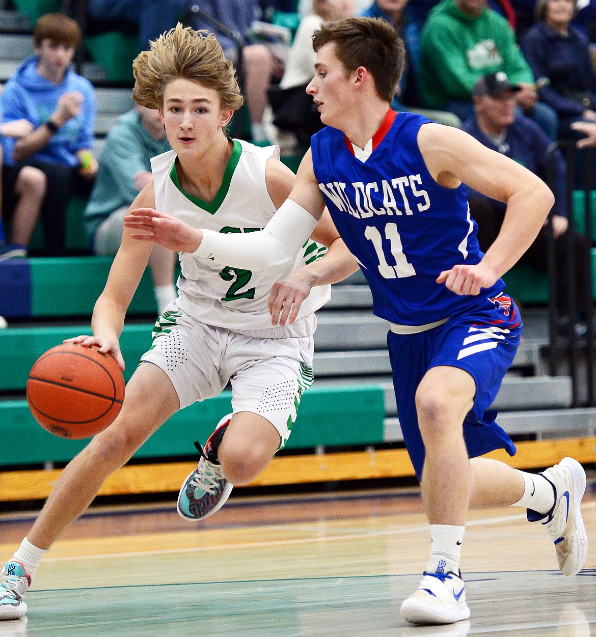 Glacier's Keifer Spohnhauer drives to the basket against Columbia Falls' Jack Price in the first half at Glacier High School on Thursday. (Casey Kreider/Daily Inter Lake)