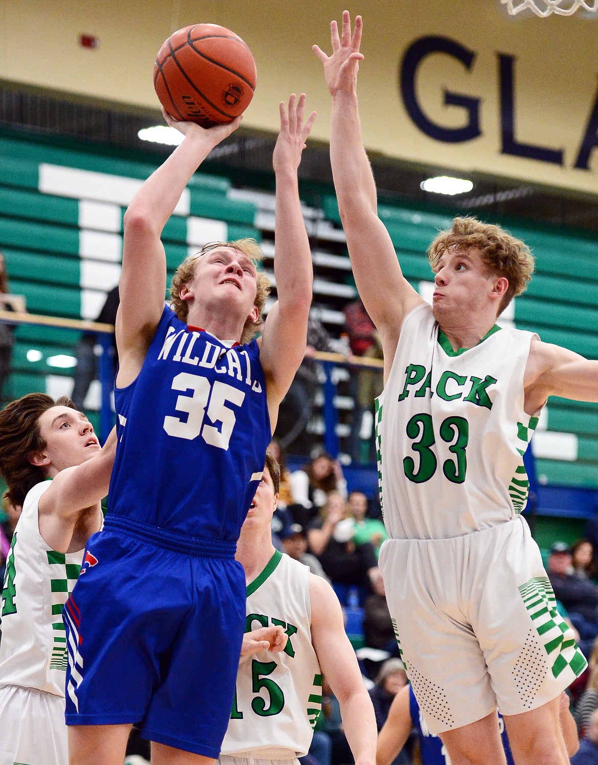 Columbia Falls' Allec Knapton drives to the basket against Glacier's Colin Presnell in the second half at Glacier High School on Thursday. (Casey Kreider/Daily Inter Lake)