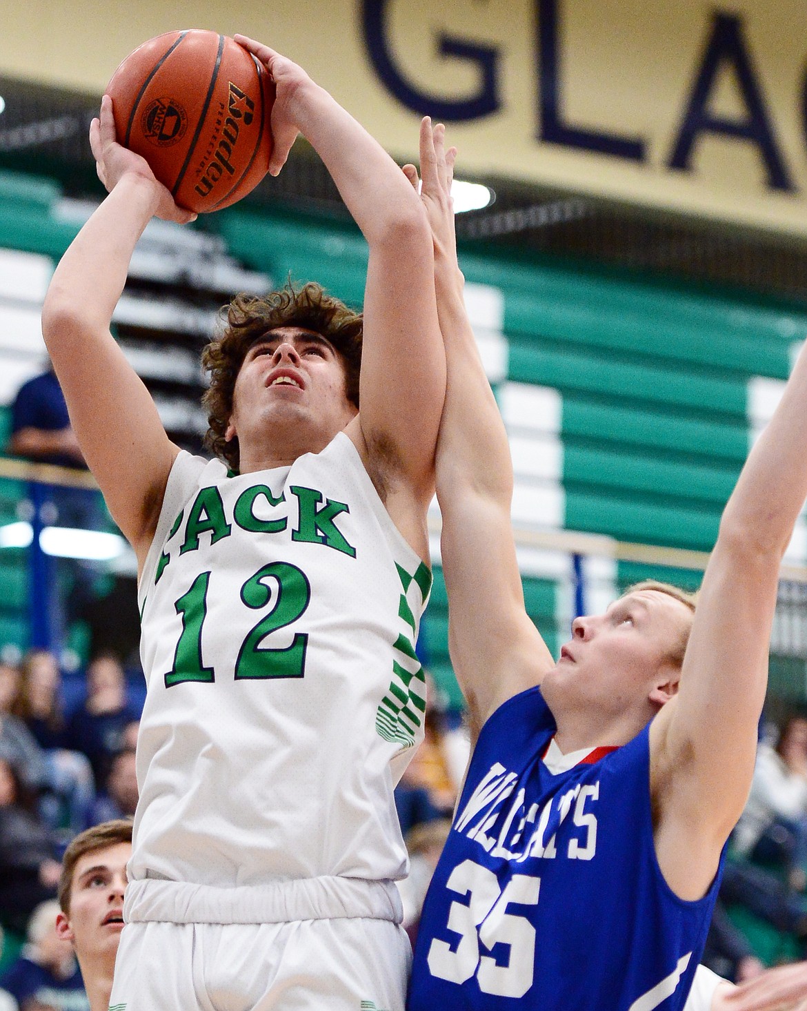 Glacier's Weston Price goes to the hoop against Columbia Falls' Allec Knapton in the first half at Glacier High School on Thursday. (Casey Kreider/Daily Inter Lake)