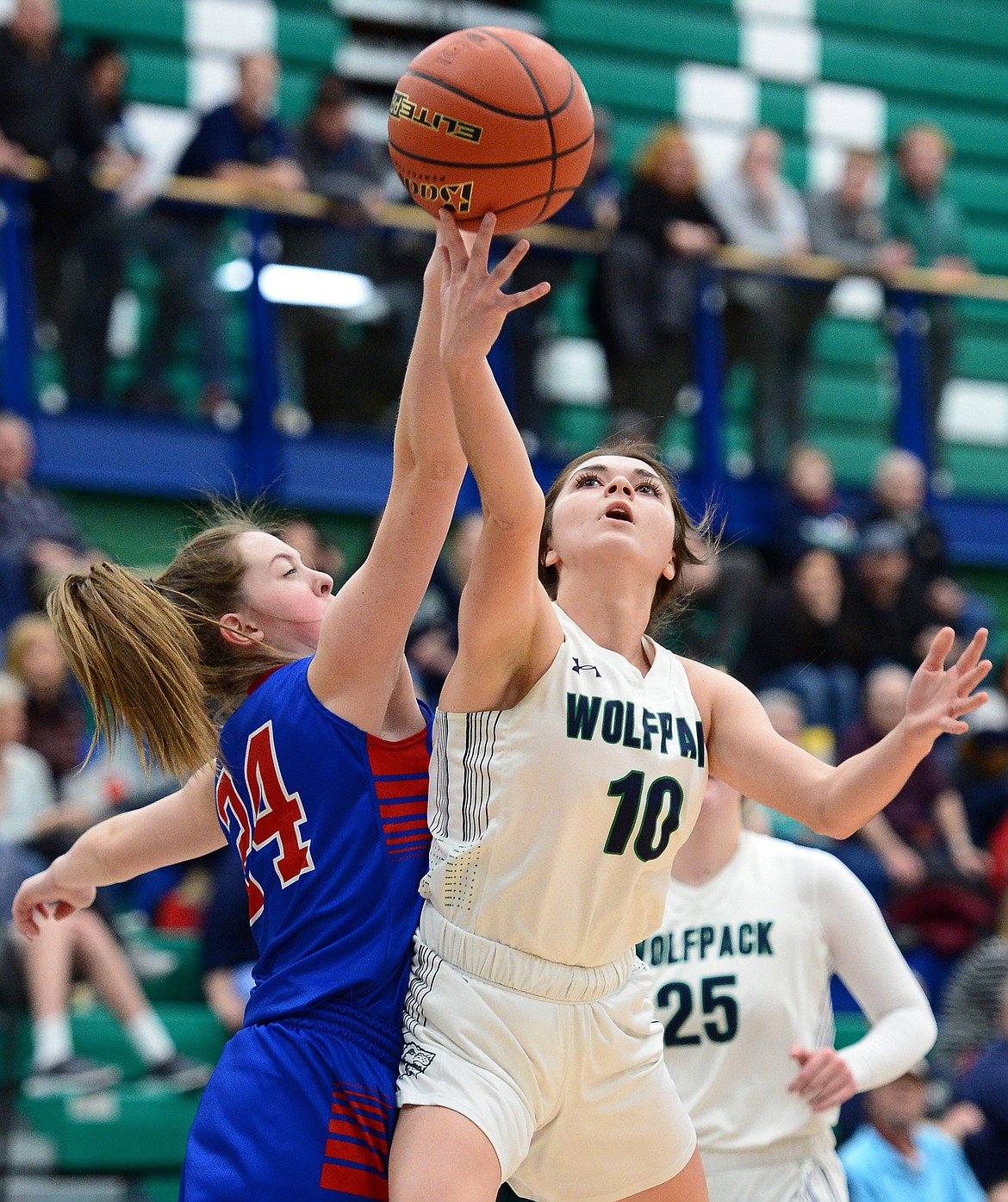 Glacier's Blayke Foppiano drives to the basket against Columbia Falls' Lauren Falkner in the second quarter at Glacier High School on Thursday. (Casey Kreider/Daily Inter Lake)