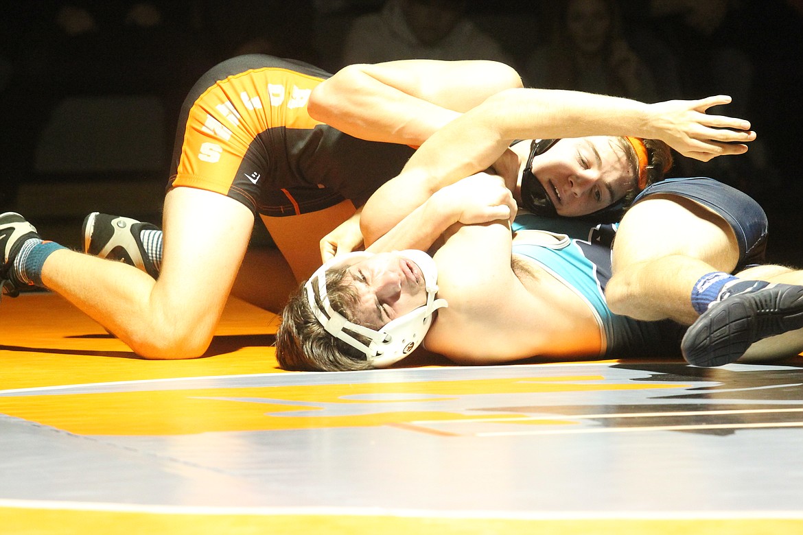 JASON ELLIOTT/Press
Post Falls wrestler Ethan Miller pushes the shoulder of Gavin Tuttle to the mat at 152 pounds in a dual with Lake City on Thursday at The Arena.