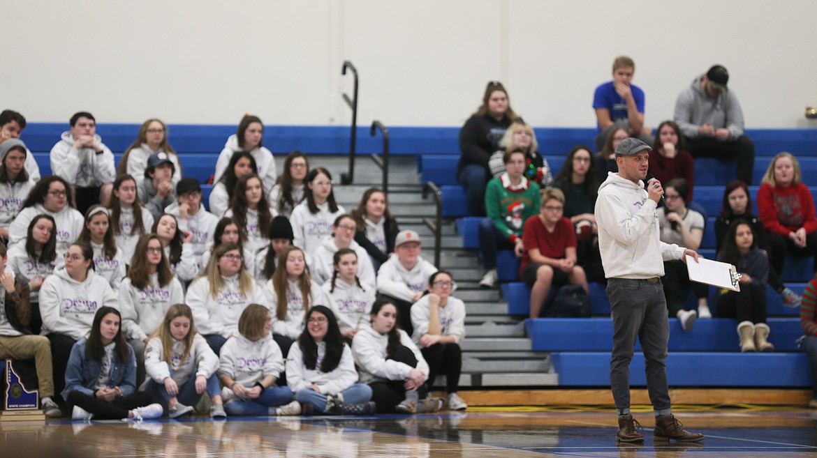 Coeur d'Alene High drama coach and theater instructor Jared Helm shares the good news of the CHS Theatre Department winning first at state during an assembly Thursday morning. (DEVIN WEEKS/Press)