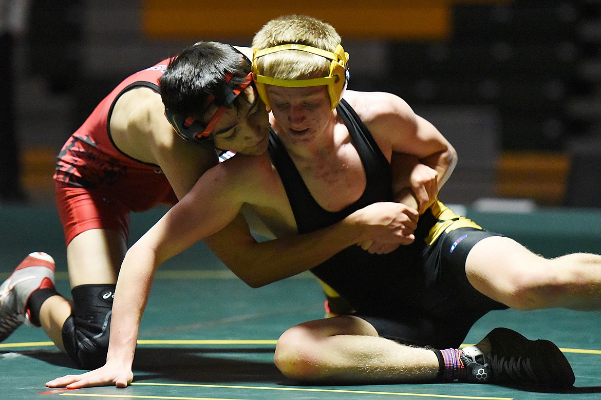 Whitefish's Carter Moran wrestles Browning's Ashton Flammond at 126 lbs. at Whitefish High School on Tuesday. (Casey Kreider/Daily Inter Lake)