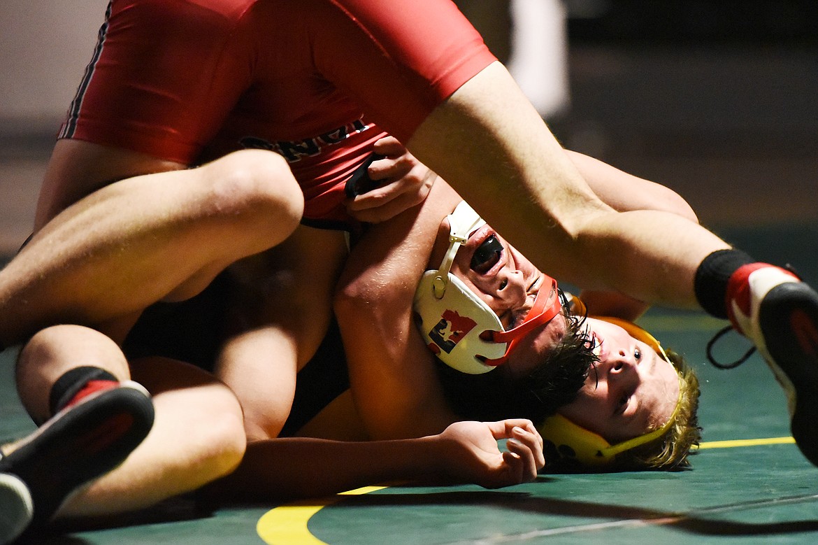 Whitefish's Rylee Creasey wrestles Browning's Jhase Monroe (Braverock) at 152 lbs. at Whitefish High School on Tuesday. (Casey Kreider/Daily Inter Lake)