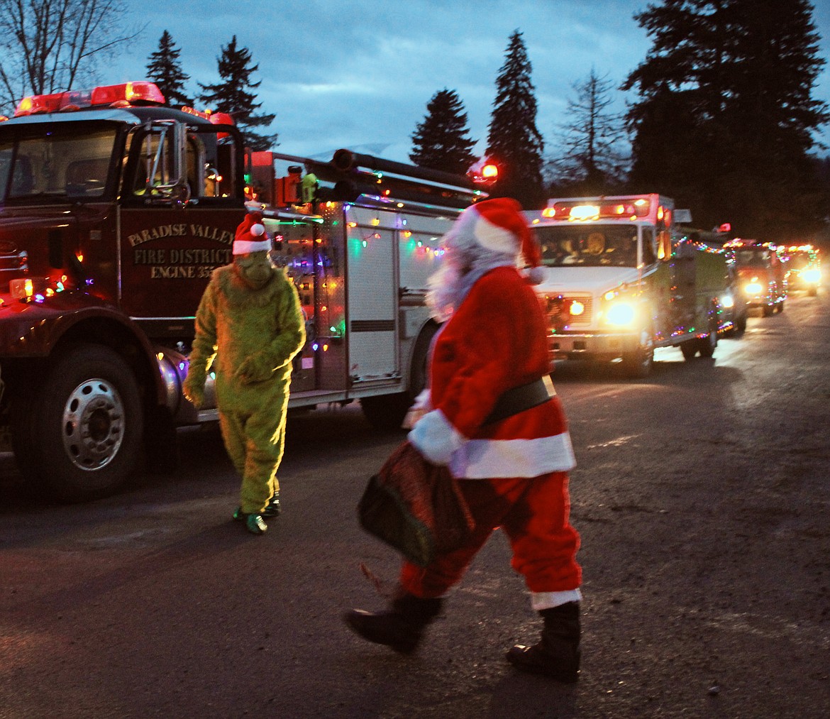 Photo by TONIA BROOKS
The Grinch went along for the ride with Santa Claus.