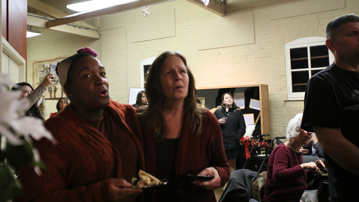 DEVIN WEEKS/Press
Tiffany Toston-Lopez of Post Falls, left, and Kathy Gurko of Coeur d&#146;Alene sing &#147;Imagine&#148; by John Lennon during a sing-along in the Human Rights Education Institute during International Human Rights Day on Tuesday evening.