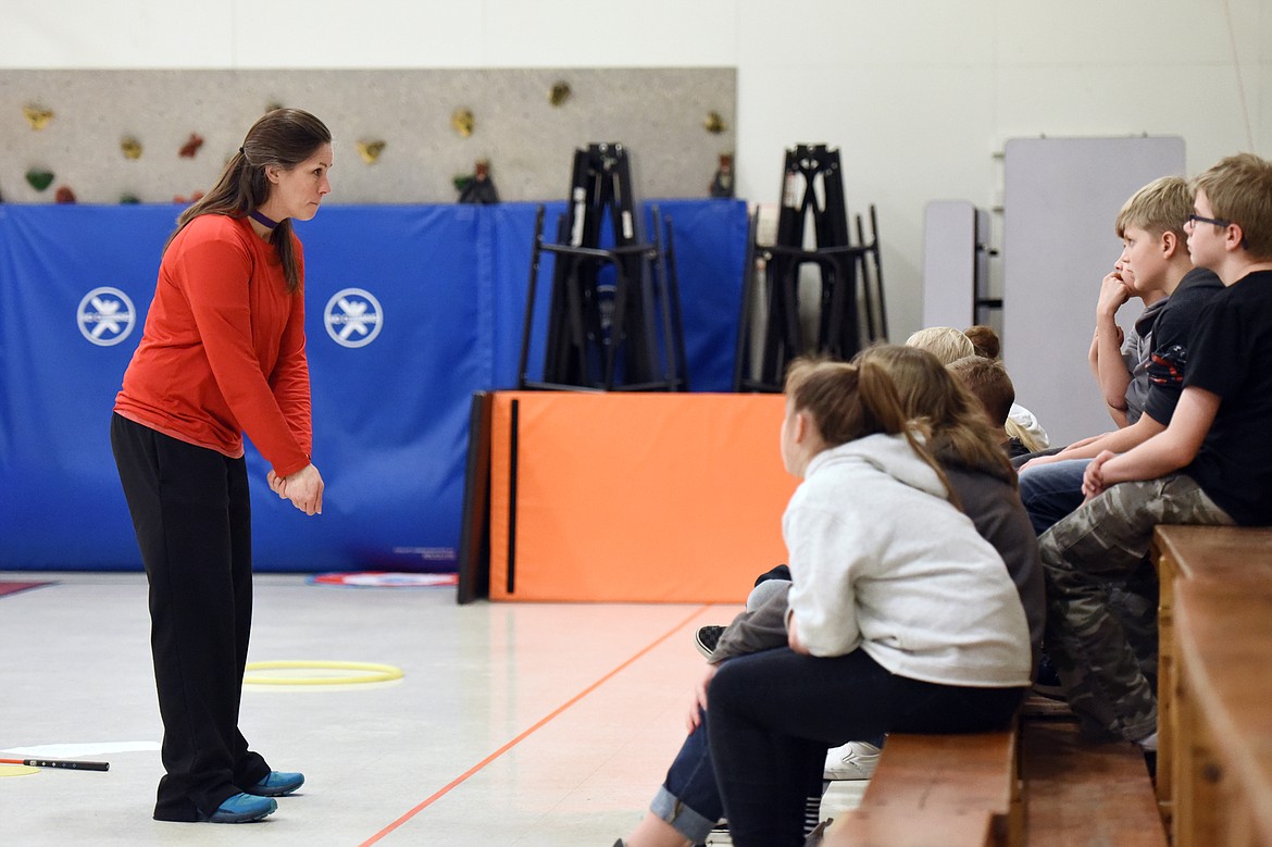 Teacher Teresa Mumm talks to her sixth-graders about the fundamentals of putting during a golf program at Creston School on Wednesday, Dec. 11. (Casey Kreider/Daily Inter Lake)