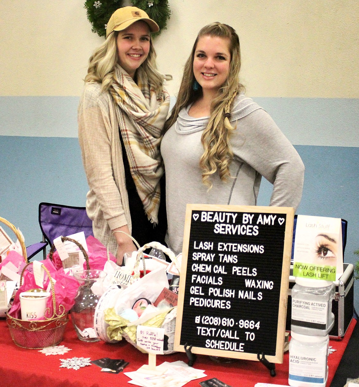 Emily Smith and Amy Wenger of Picturesque Salon offer raffle tickets for salon services, with winners to be drawn Dec. 20.