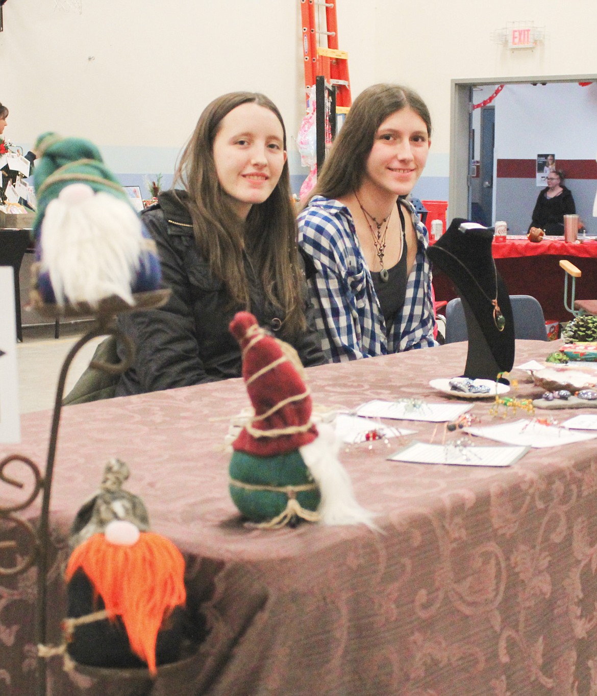 Photos by TONIA BROOKS
Sisters Becca and Nelly Harmon man their gnome, spider, and jewelry booth during the Naples Holiday Craft Fair.