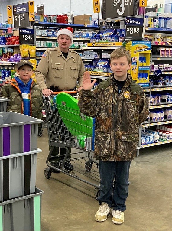 Photo by HEATHER COWAN
Sheriff Mike Gunderson shops with his kids at Walmart.