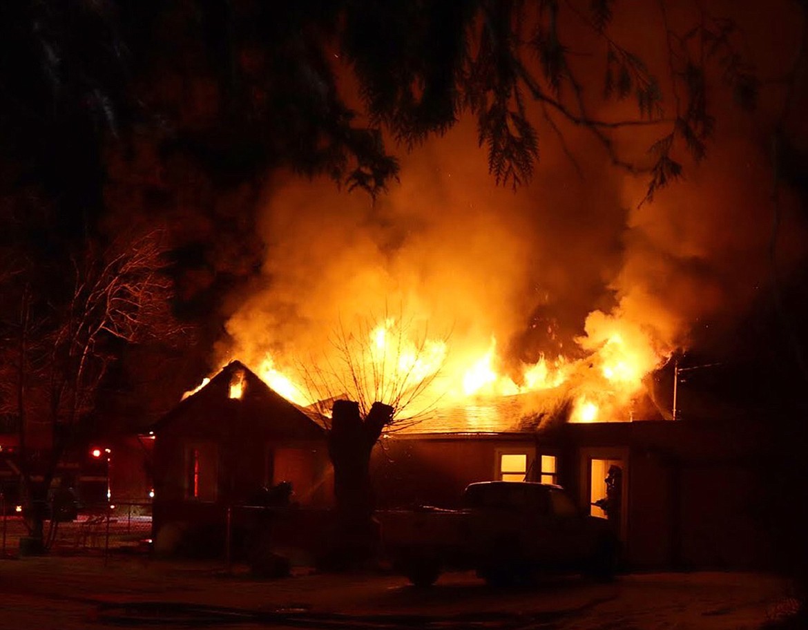 This home at 1135 Third Avenue West saw its roof heavily damaged by fire Sunday morning. Photo courtesy of Jodee Perkins.