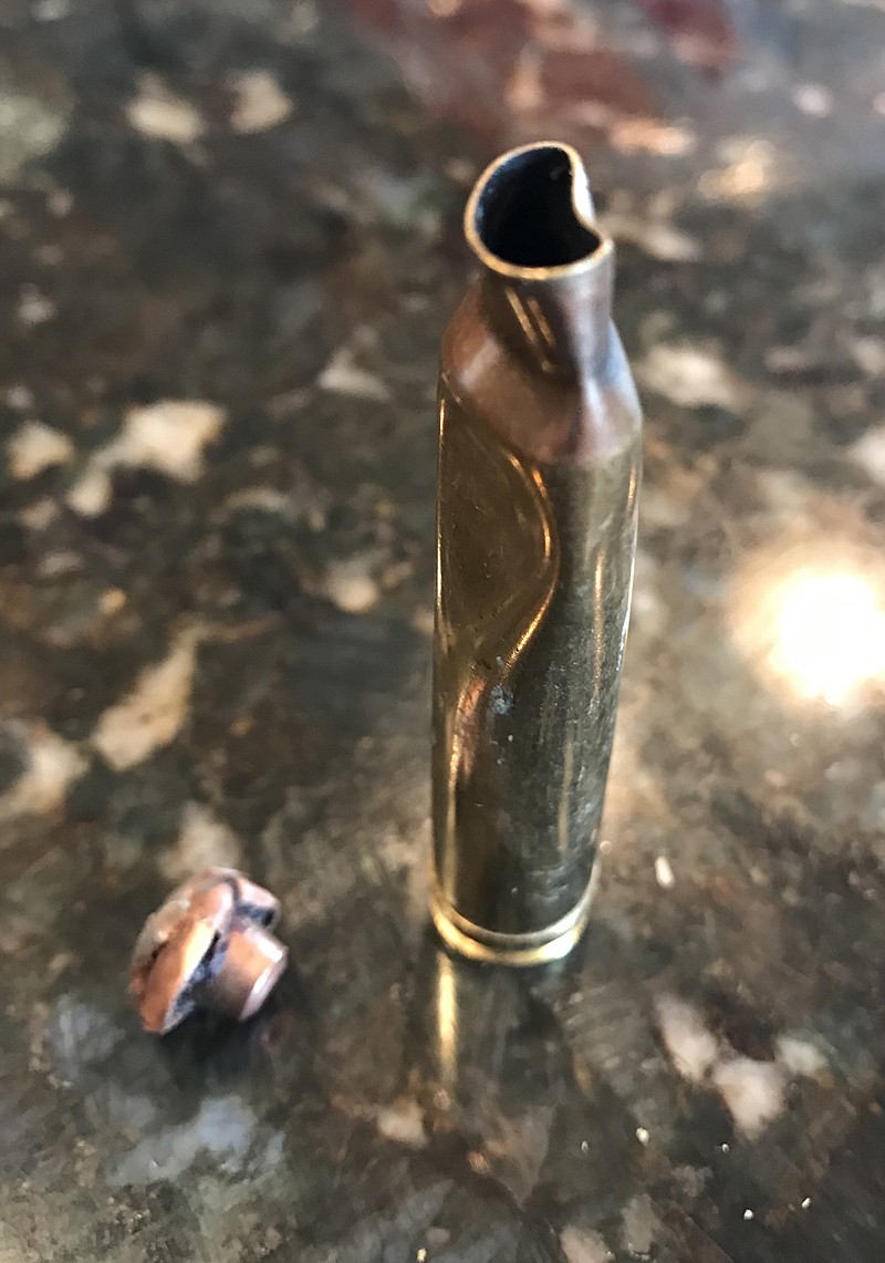 The mushroomed bullet and the case that held it from Johnny Willcut&#146;s successful mountain goat hunt. The case was dented from the fall Willcut took as he worked to pack the goat off the mountain. (John Wilcutt photo)