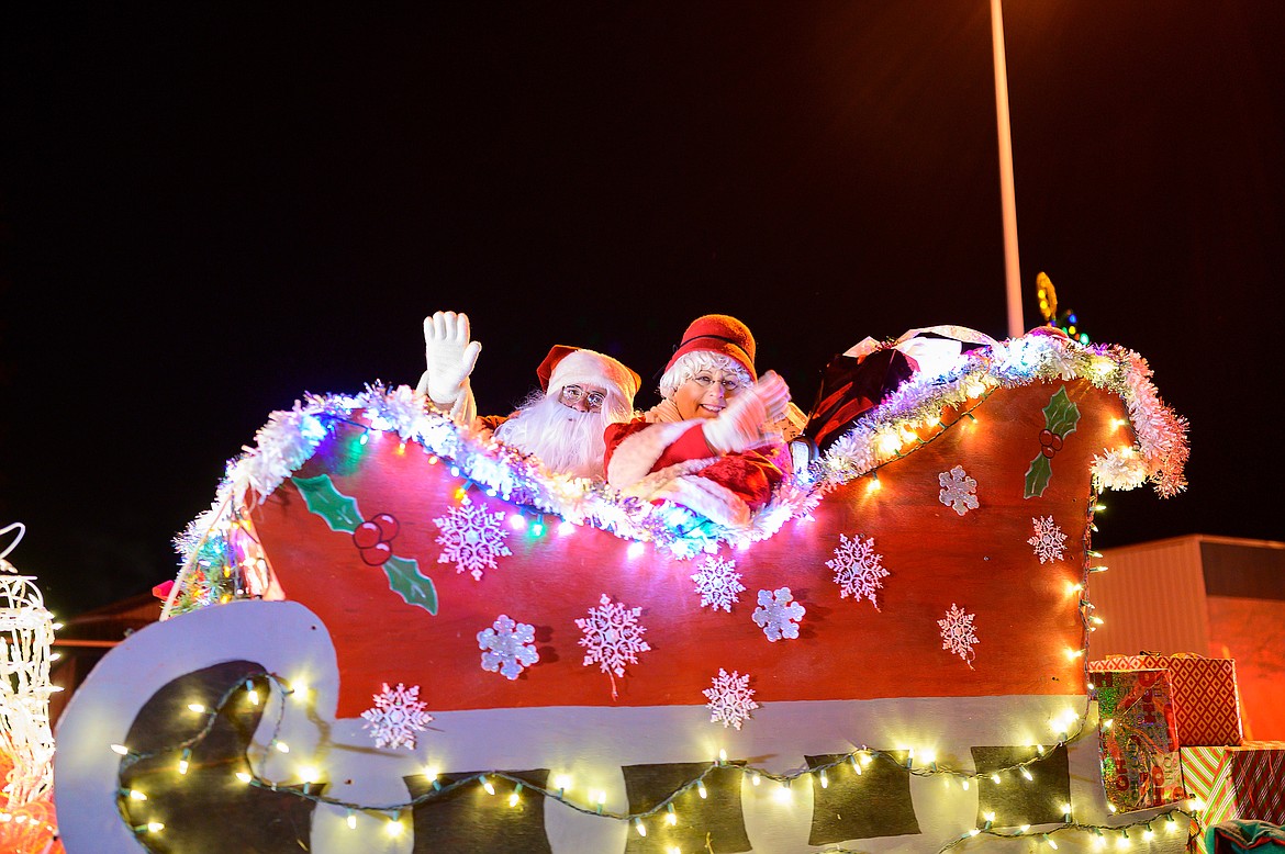 Santa and Mrs. Claus wave to the crowd during the Night of Lights parade.