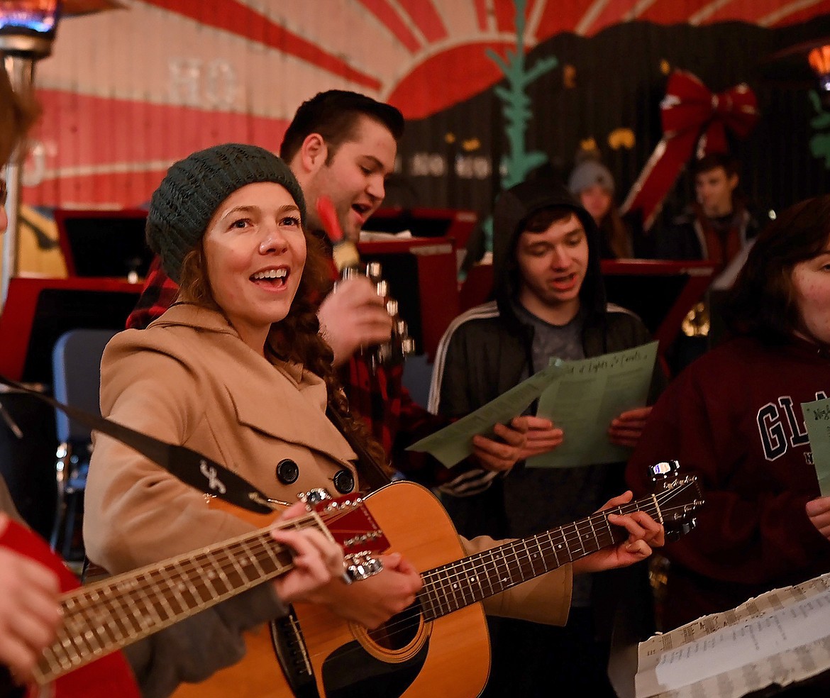 Emily Heckathorn leads the Sonifers in song during the Night of Lights celebration.