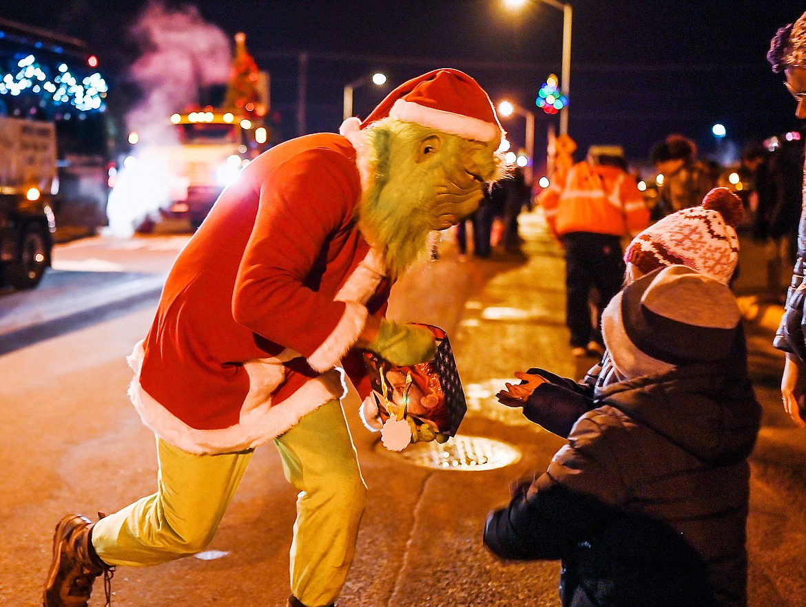 The Bee Hives Homes Grinch hands out treats during the parade.