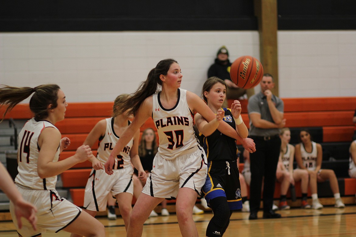 Kylie Altmiller (30) of Plains and Lexa Craft (14) play defense against Victor in Friday&#146;s game in the tip-off tournament in Ronan. (Chuck Bandel/Valley Press)