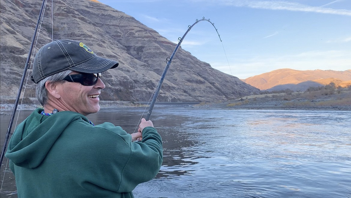 (Photo courtesy Tim Akimoff/ODFW)
Joe DuPont, regional fisheries manager for the Idaho Department of Fish and Game, fights a large sturgeon during the Sturgeon Summit on the Snake River.