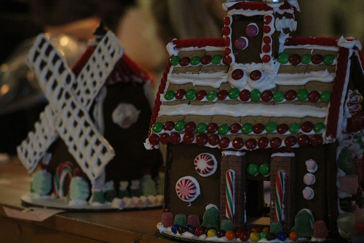 A gingerbread house in front of a gingerbread windmill. (John Dowd/Clark Fork Valley Press)