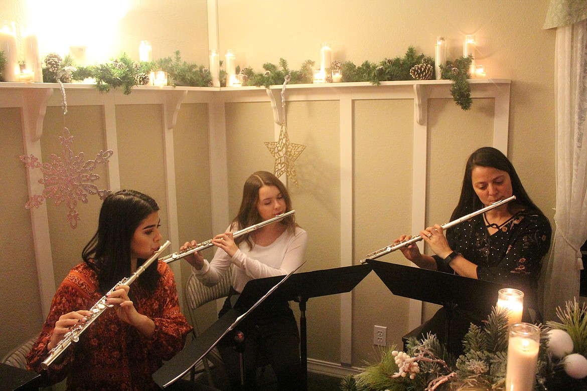 Cree Lulack, Kaylie Peele and Mrs. Nichols playing music during the Tree of Life ceremony last Wednesday night. (John Dowd/Clark Fork Valley Press)