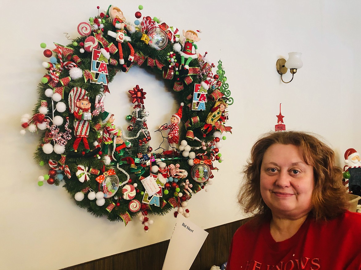 Photo by JOSH McDONALD
Susan Johnson shows off her specialty decorated wreath that is available as part of the Festival of Trees. Johnson also did a tree, both are displayed at the Senior Services Center.