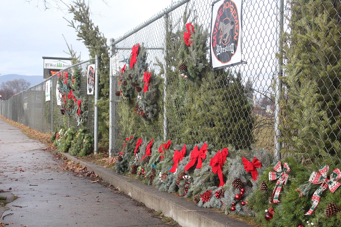 Christmas trees and wreaths set up on display on Plains Main Street last Saturday morning. (John Dowd/Clark Fork Valley Press)