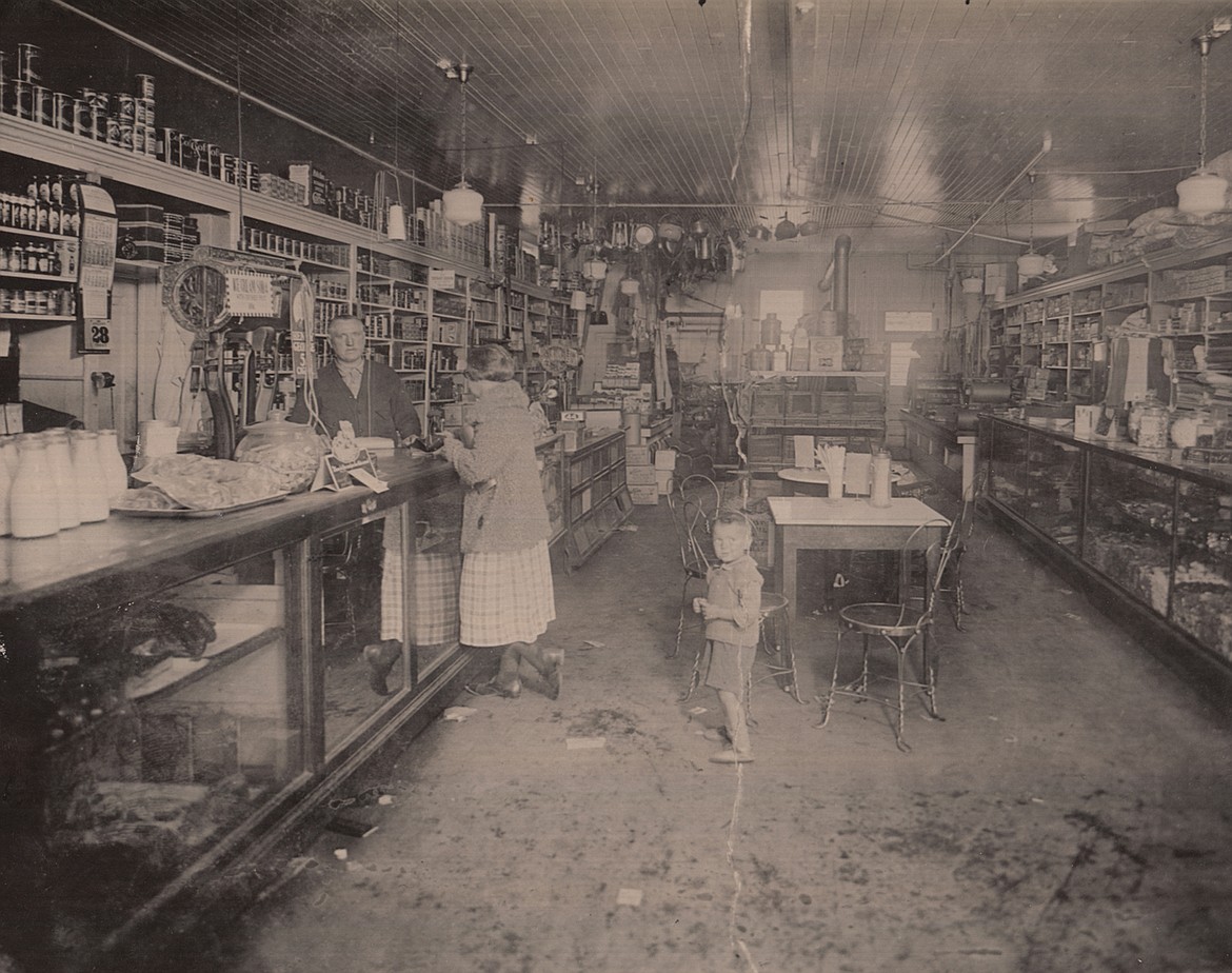 William Castle, founder of the store, stands behind the counter. (Photo courtesy Castle Family archives)