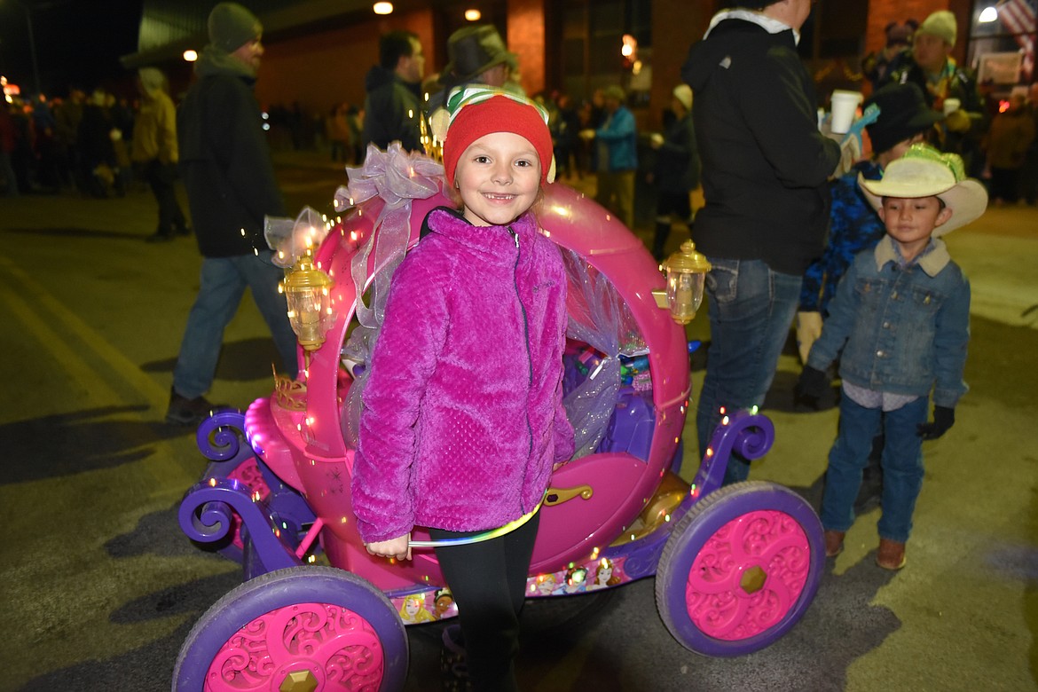 Tenlie O&#146;Roake brings magic to the parade with a Cinderella wagon. (Carolyn Hidy/Lake County Leader)