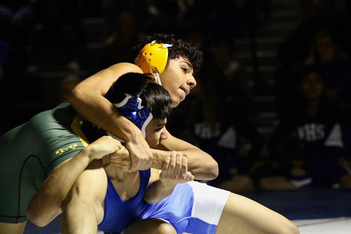 Casey McCarthy/Sun Tribune 
Quincy&#146;s Israel Perez fights for position against Isreal Hernandez in the matchup at 132 pounds at Warden High School on Thursday.