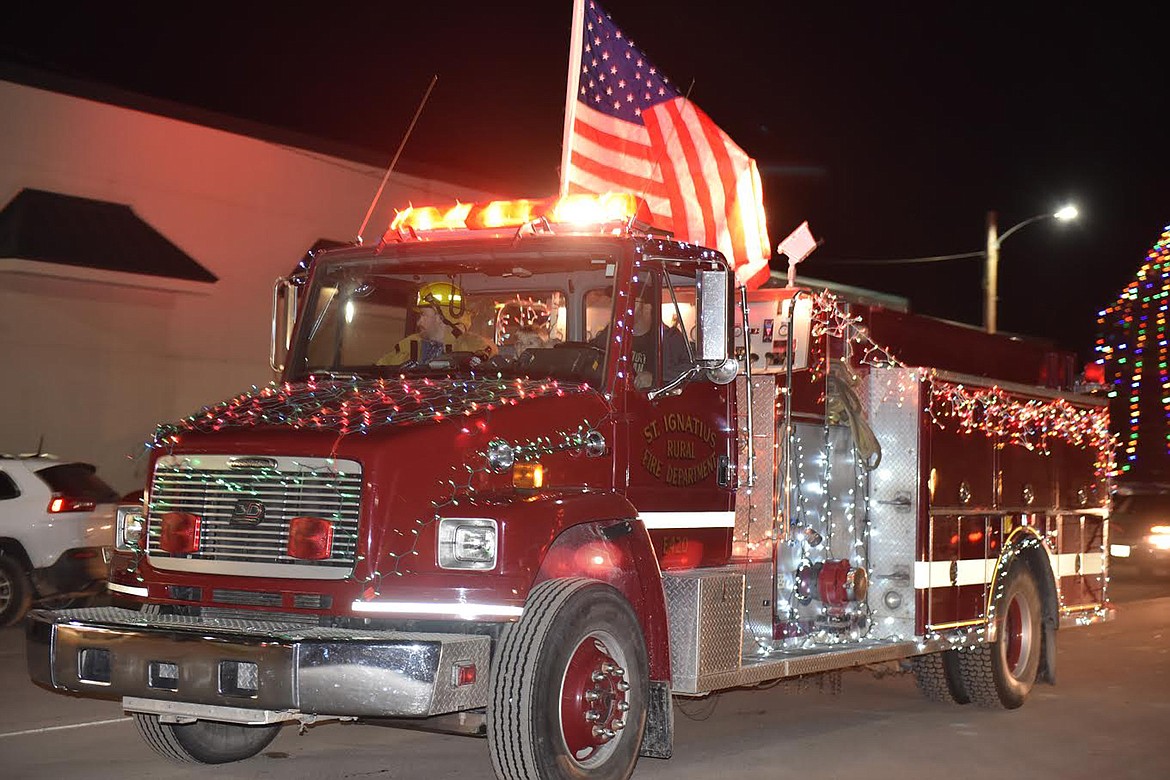 The St. Ignatius Rural Fire Department truck was decked out in Stars and Stripes and Christmas lights at Friday&#146;s parade. (Carolyn Hidy/Lake County Leader)