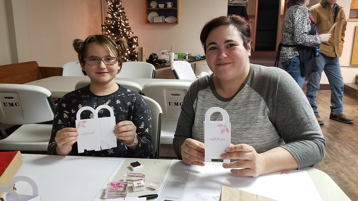 Ten-year-old Sophia Jackson and her mother, Cheryl Jackson, showing off their projects.