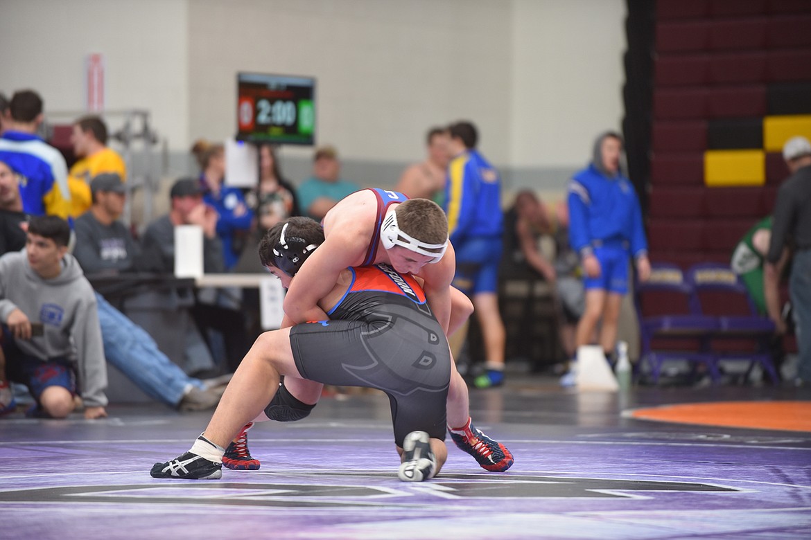 Clark Fork&#146;s Silas Acker, top, battles Bigfork&#146;s Colton Wroble during their 160-pound match Friday at the Owen Invitational at Salish Kootenai College in Pablo. Acker scored a 10-5 decision. (Scott Shindledecker/Mineral Independent)