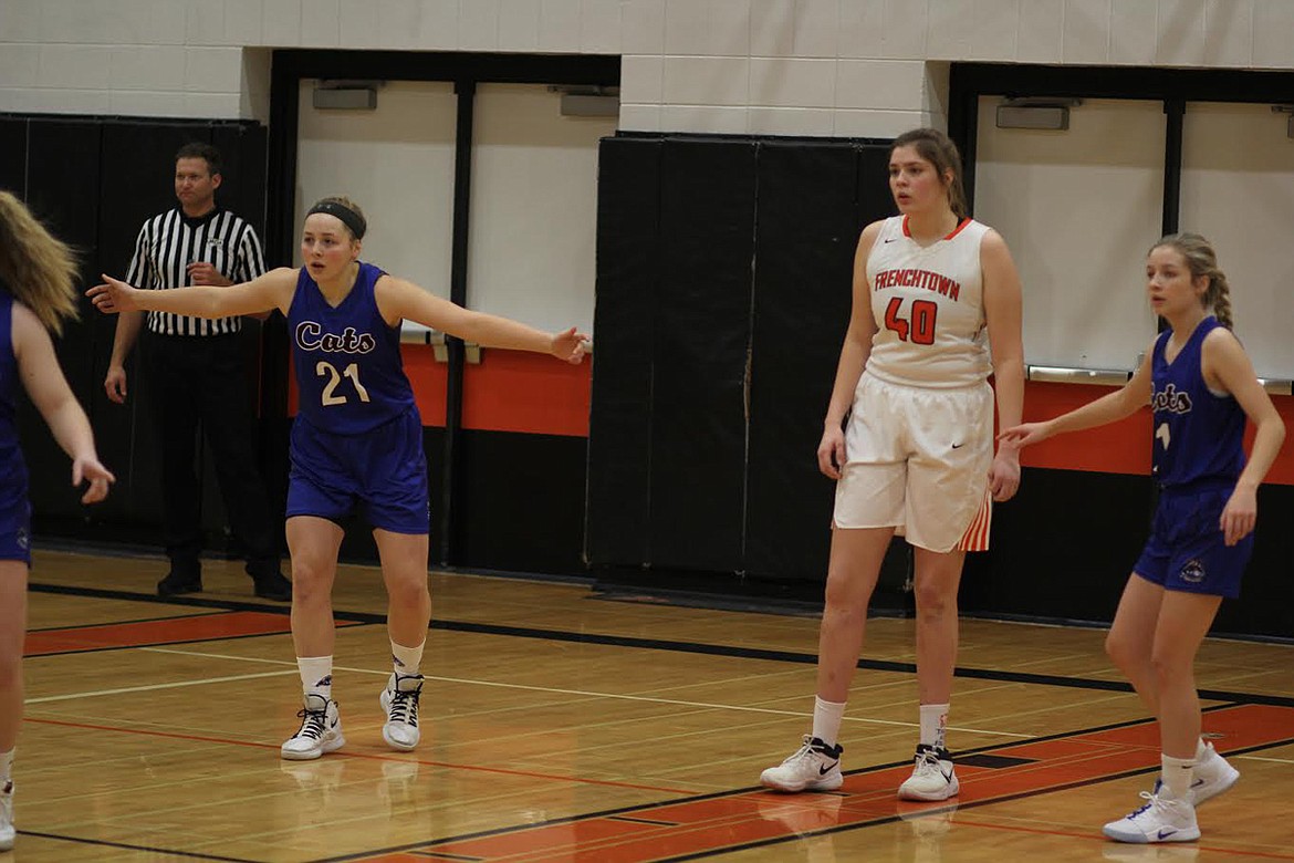 Clark Fork&#146;s Cassie Green (21) and Darby Haskins (1) work to guard Frenchtown center Harper Armirage (40) at the Ronan tip-off tournament. (Chuck Bandel/Mineral Independent)